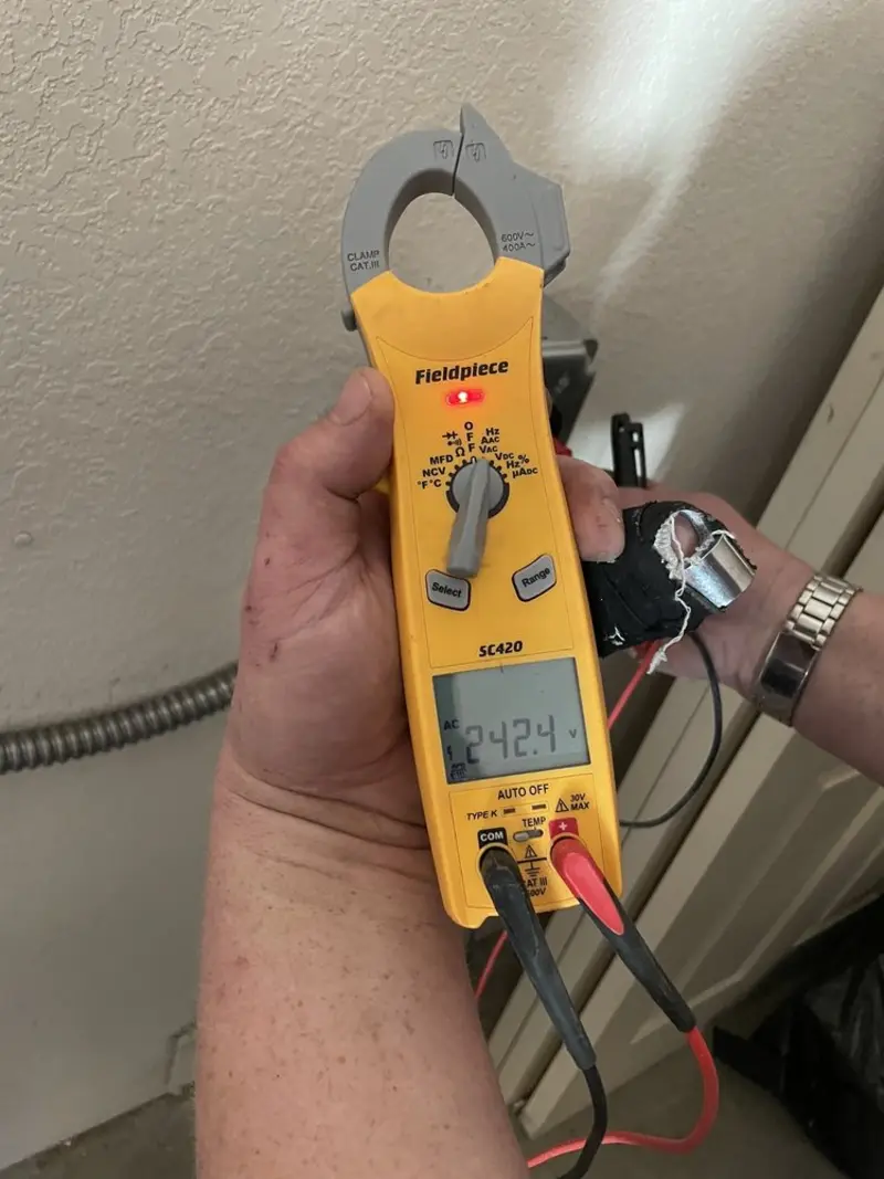 Voltage testing with clamp meter during Generator Installation in Gaylord